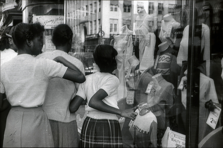 Young girls in front of a shop window in Harlem, 1951