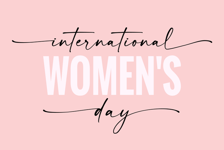 International women’s day elegant lettering on pink